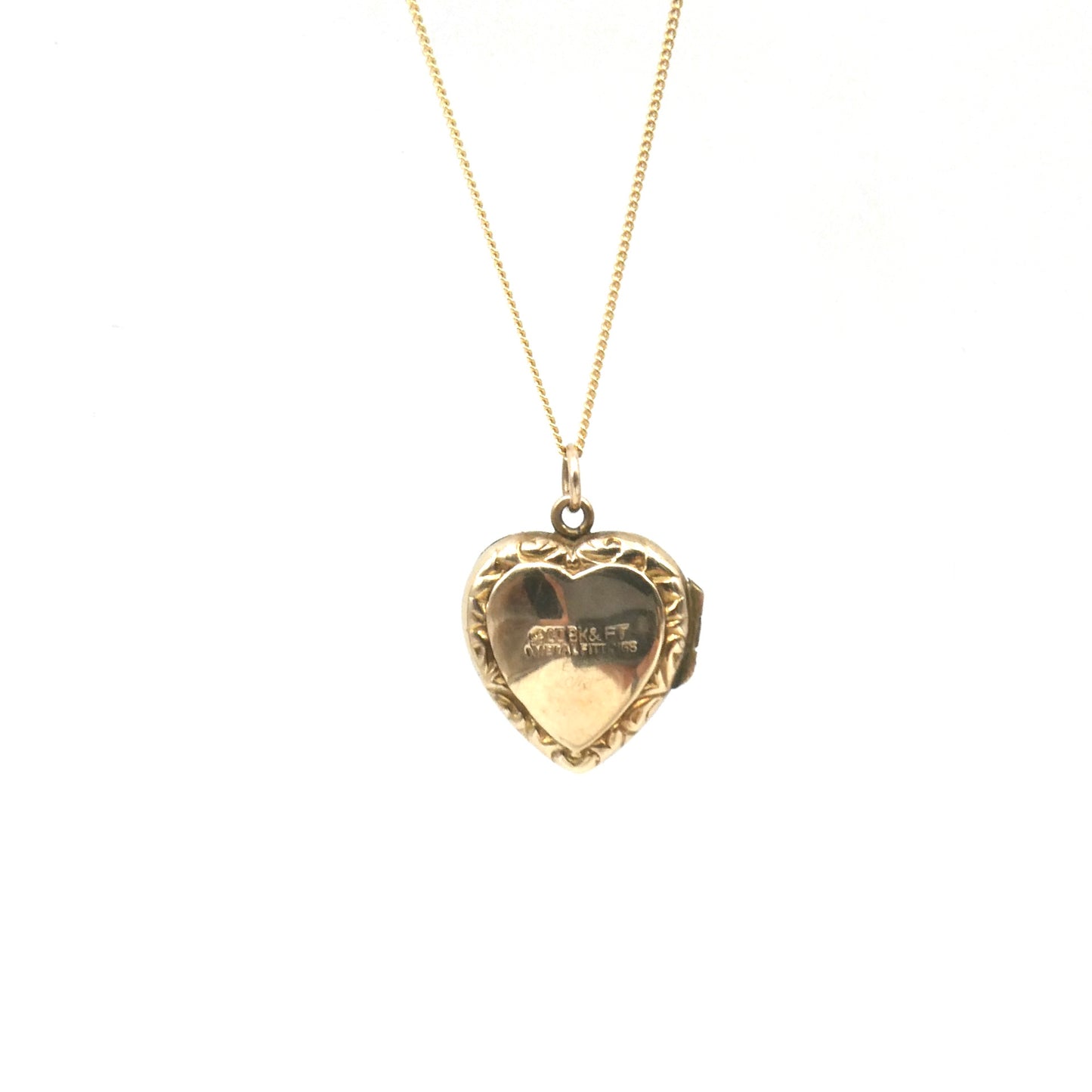 Ornate vintage locket, an engraved locket in a heart shape, back and front heart locket.
