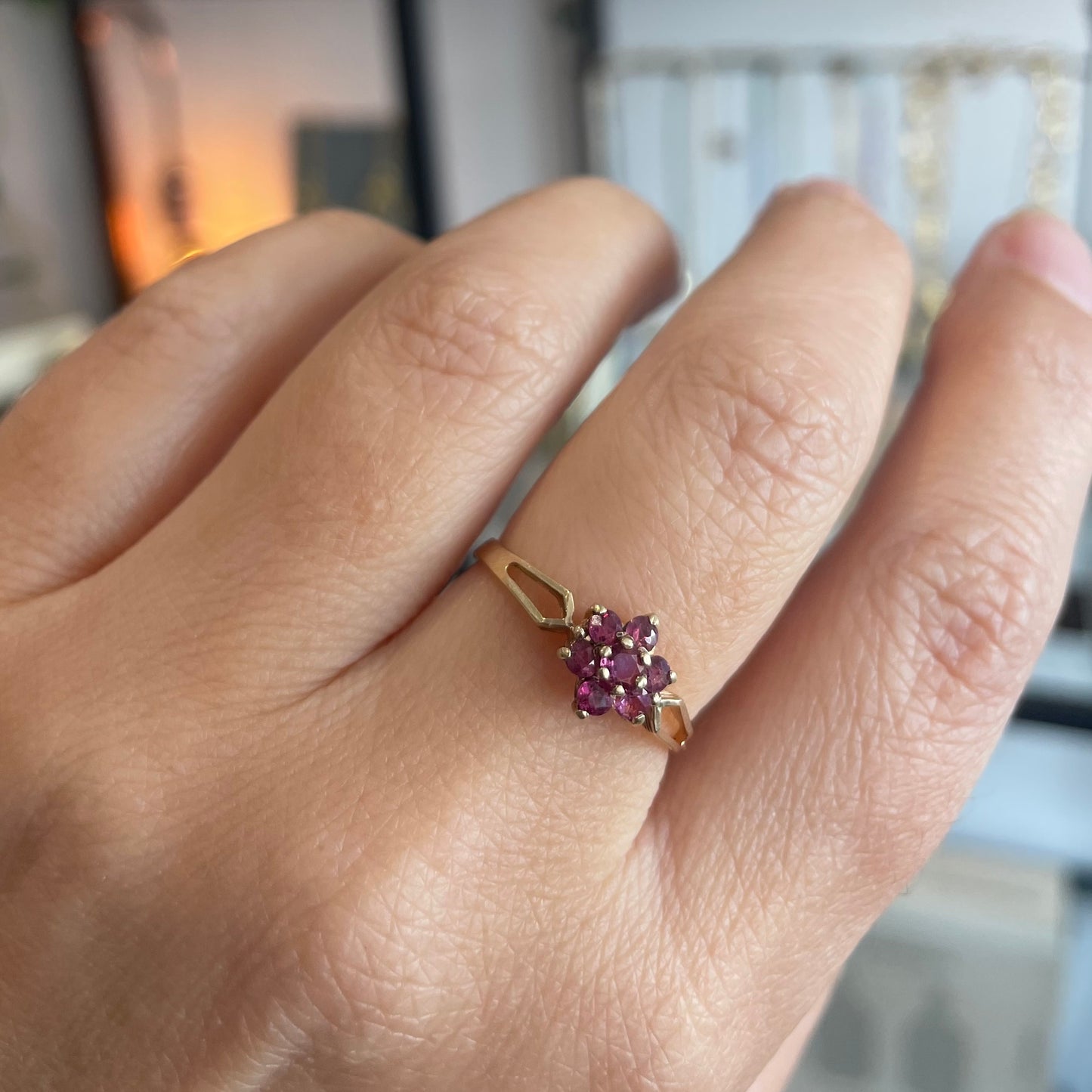 Pretty ruby flower ring with bright pink rubies in a 9kt setting, a gold daisy ring.