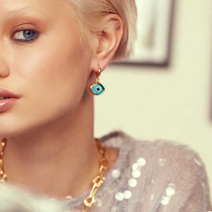 Bronte Blue Glass Evil Eye Huggie Earrings