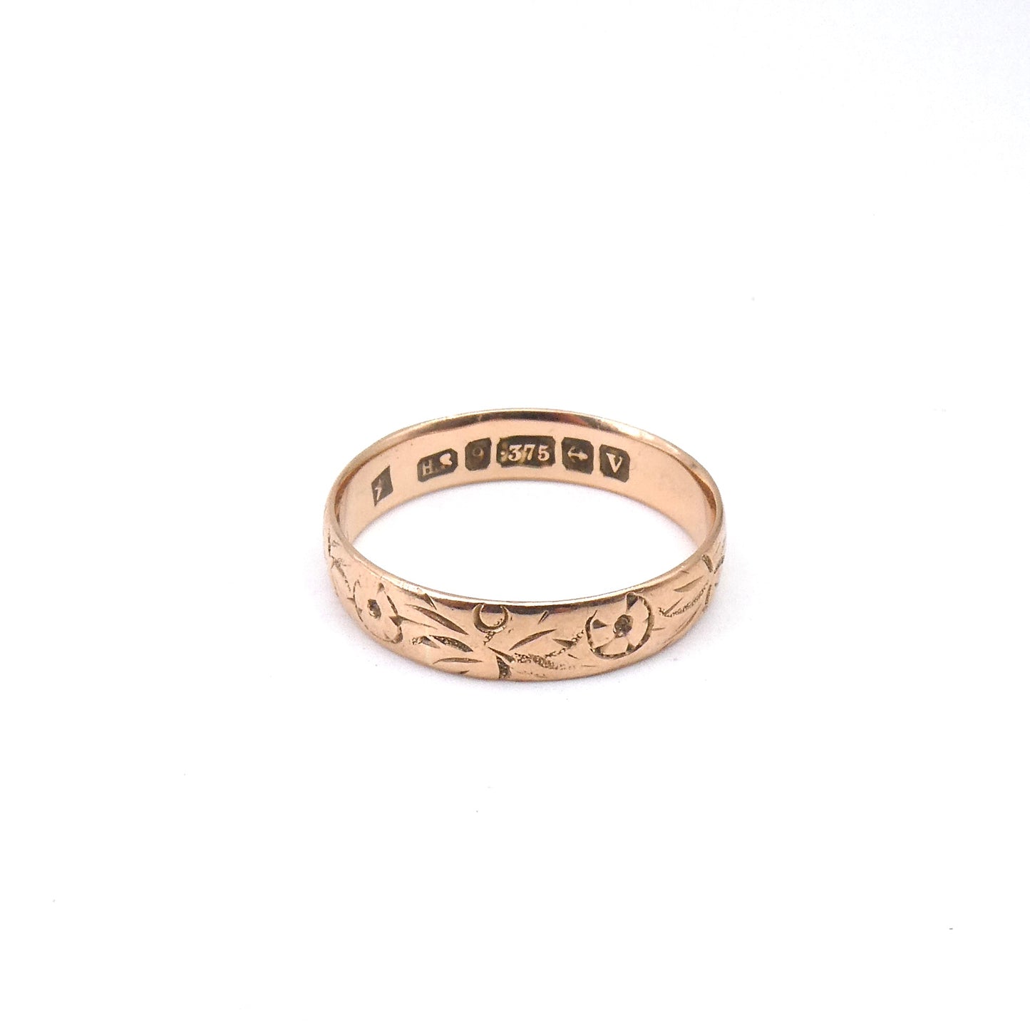 Antique engraved rose gold band encircled with a floral motif, 9kt gold.