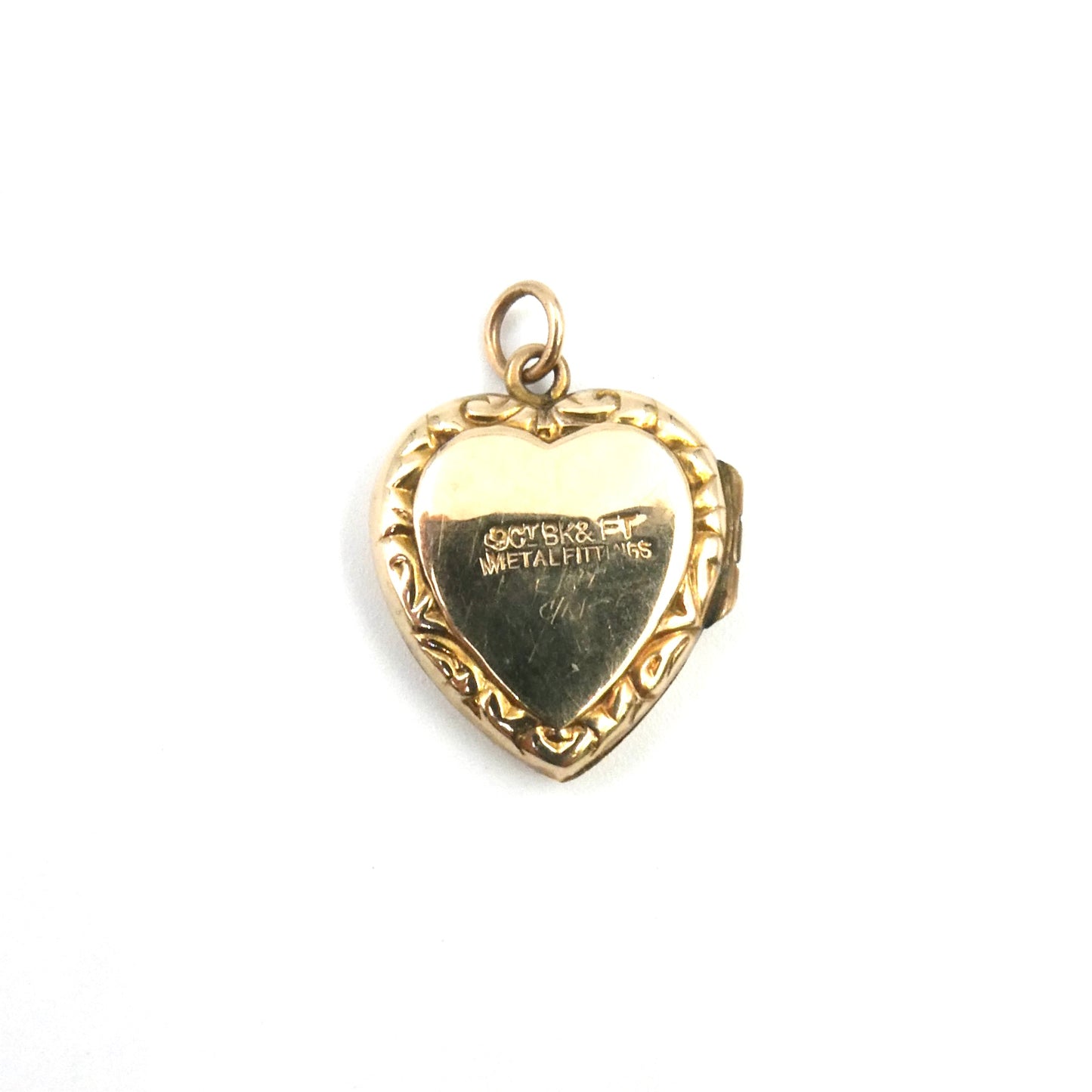 Ornate vintage locket, an engraved locket in a heart shape, back and front heart locket.