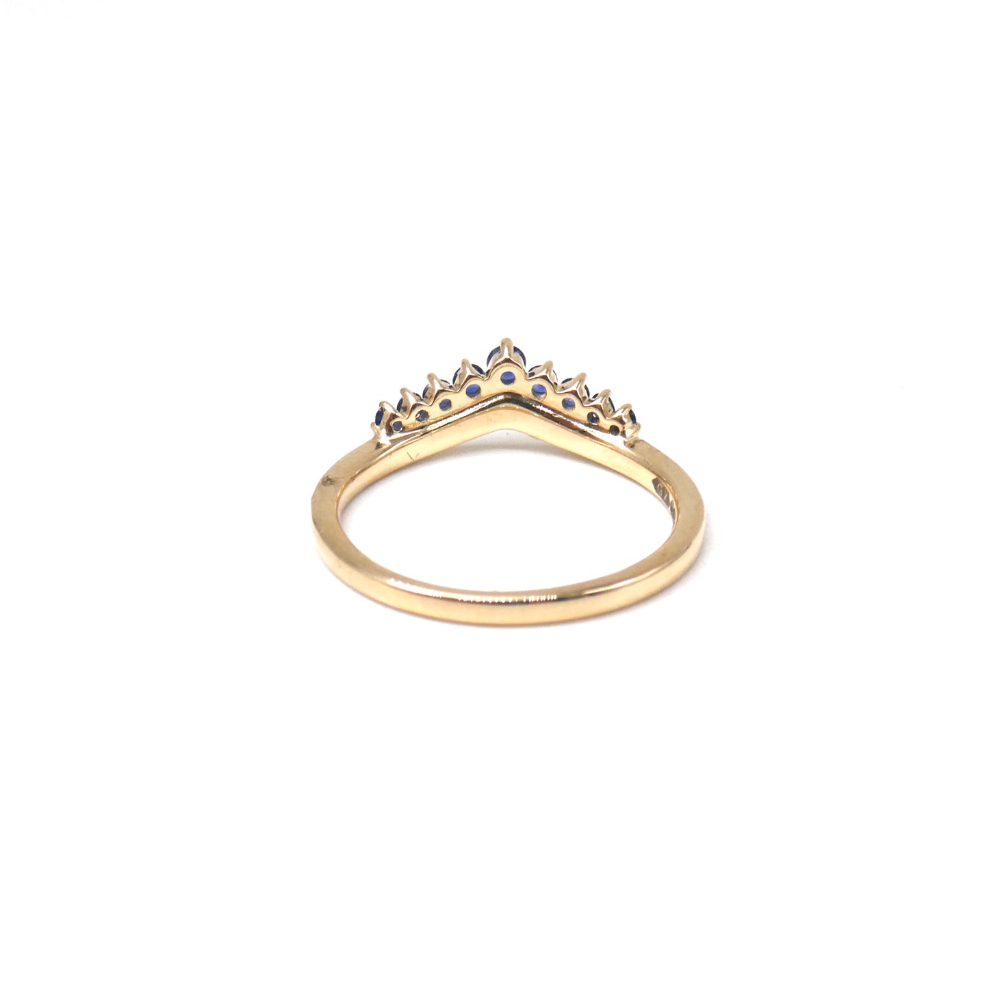 A New ring, curved diamond band with graduating sapphires.