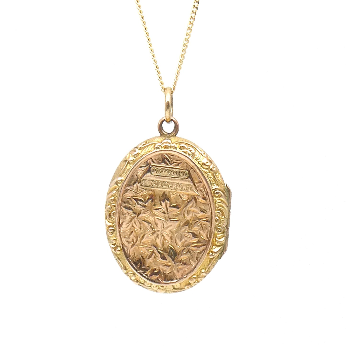 Engraved oval locket, antique gold back and front locket on a 9kt gold chain.
