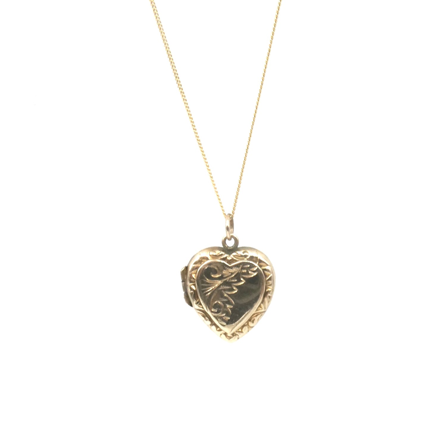 Ornate vintage locket, an engraved locket in a heart shape, back and front heart locket.