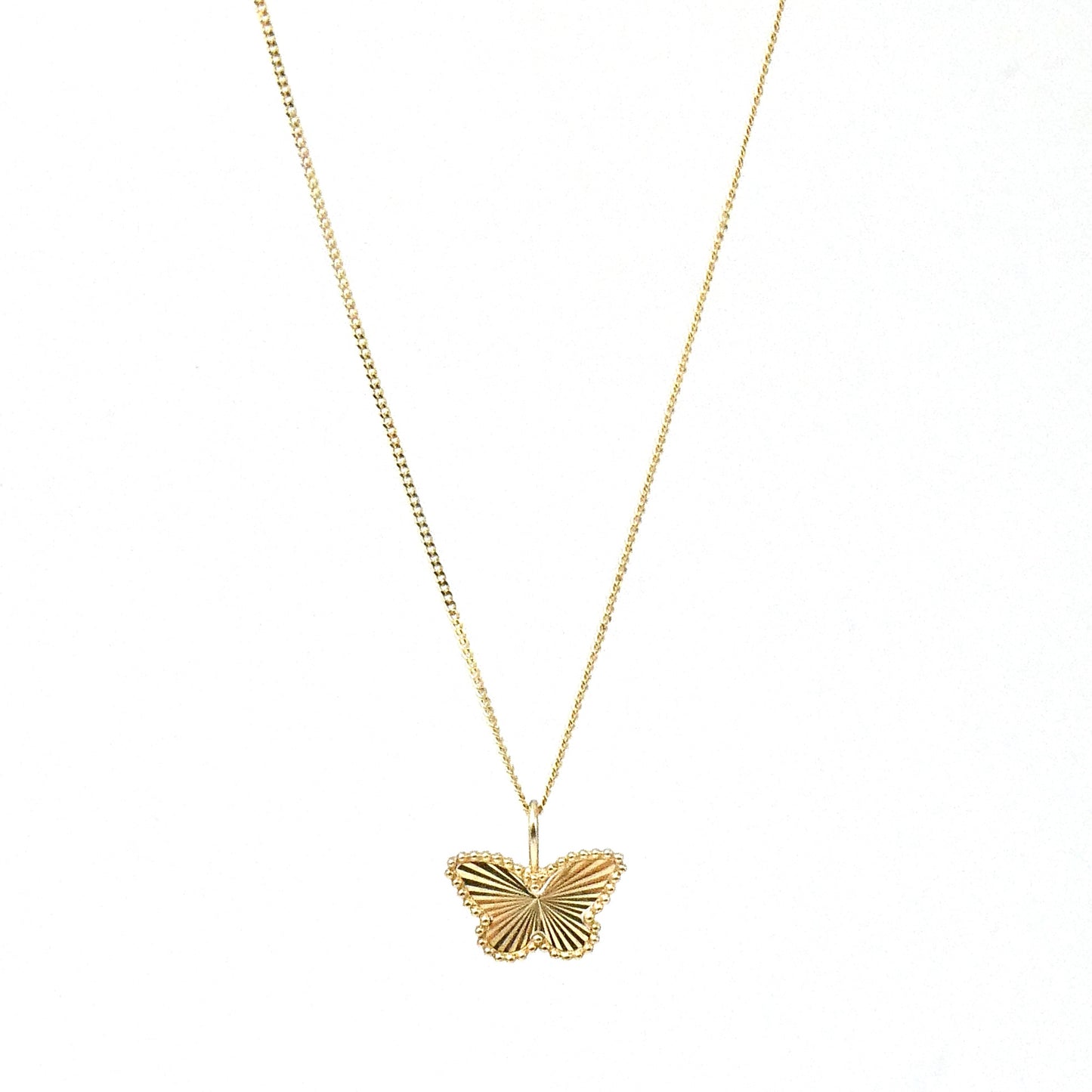 A 9kt gold faceted Butterfly pendant, a new contemporary piece.