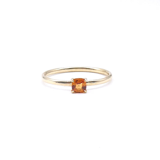 An Orange Sapphire cushion cut ring  ring, a fine 9kt gold ring.