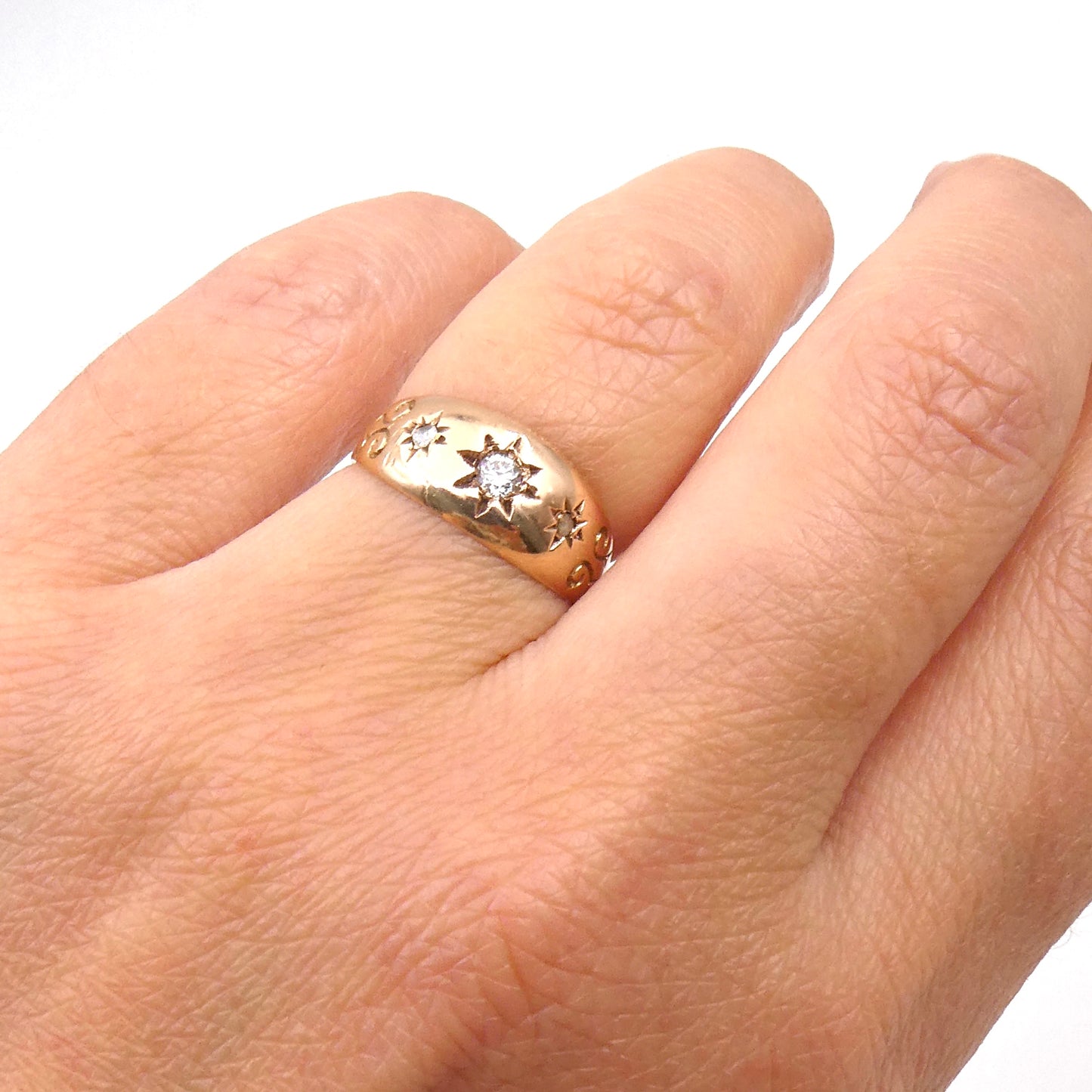 Vintage diamond gypsy ring star set, 9kt rose gold with engraved shoulders.