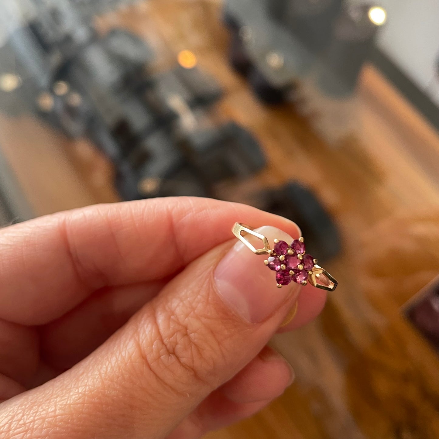 Pretty ruby flower ring with bright pink rubies in a 9kt setting, a gold daisy ring.