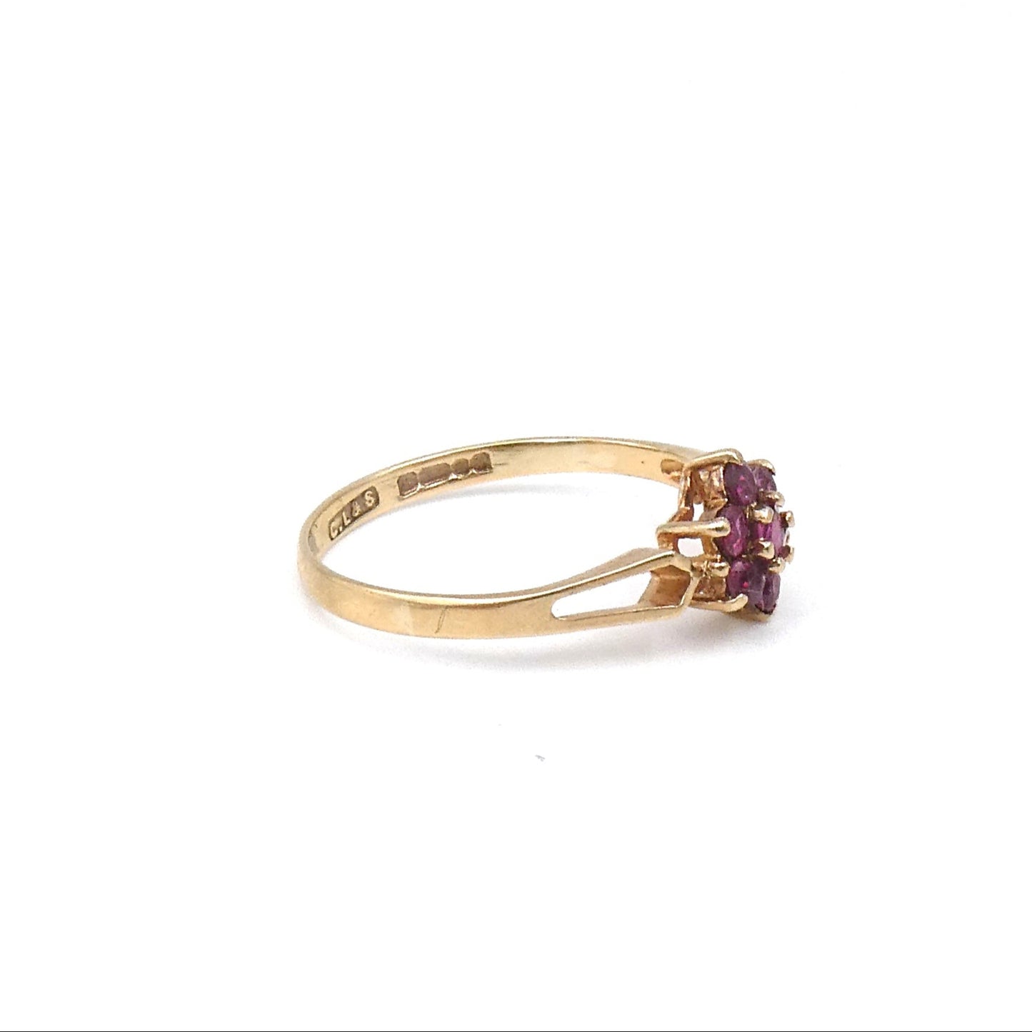 Pretty ruby flower ring with bright pink rubies in a 9kt setting, a gold daisy ring.