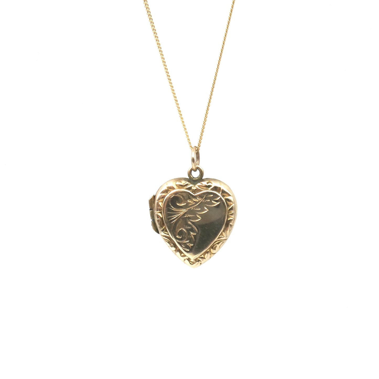 Ornate vintage locket, an engraved locket in a heart shape, back and front heart locket.