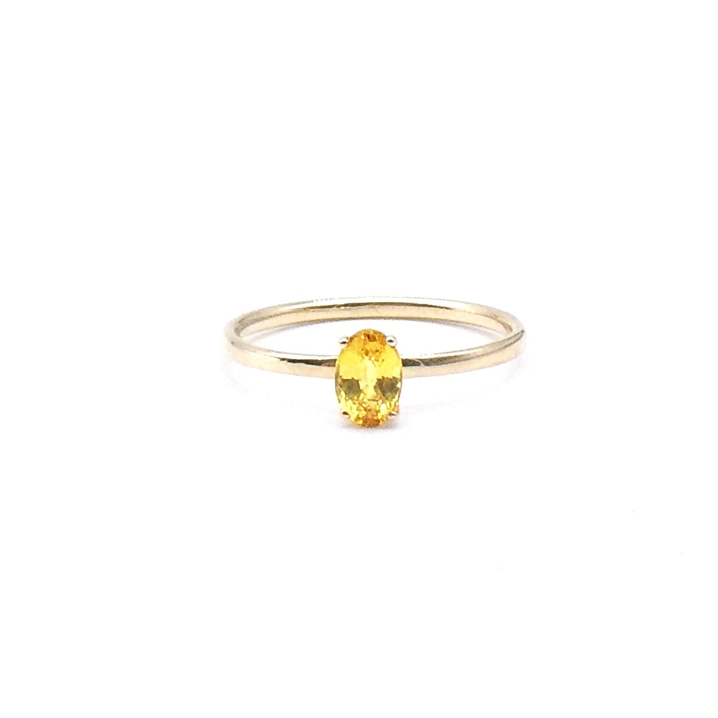 A yellow oval cut Sapphire,  a fine new 9kt gold ring.