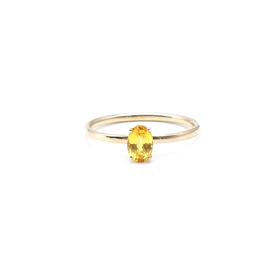 A yellow oval cut Sapphire,  a fine new 9kt gold ring.