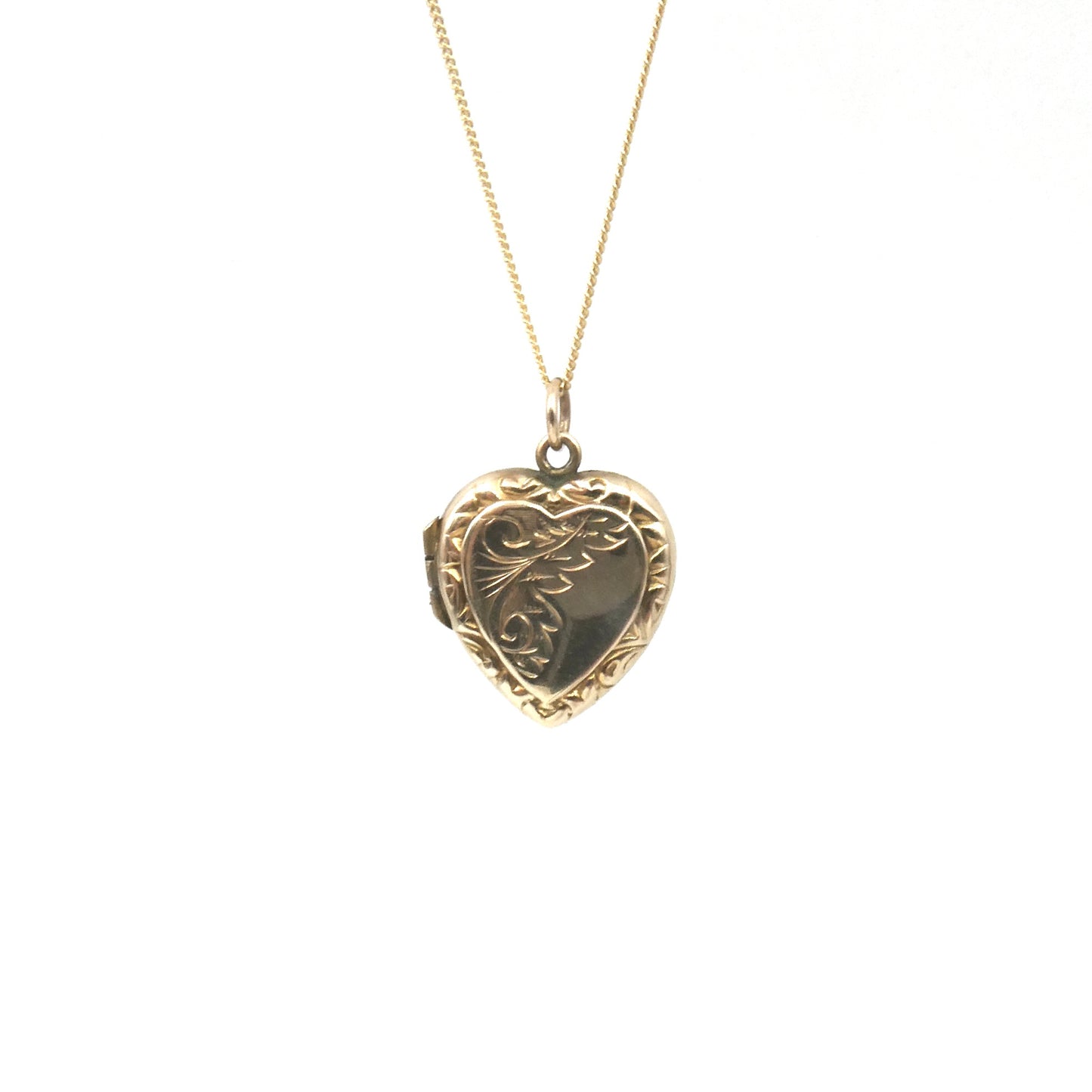 Ornate vintage locket, an engraved locket in a heart shape, back and front heart locket.