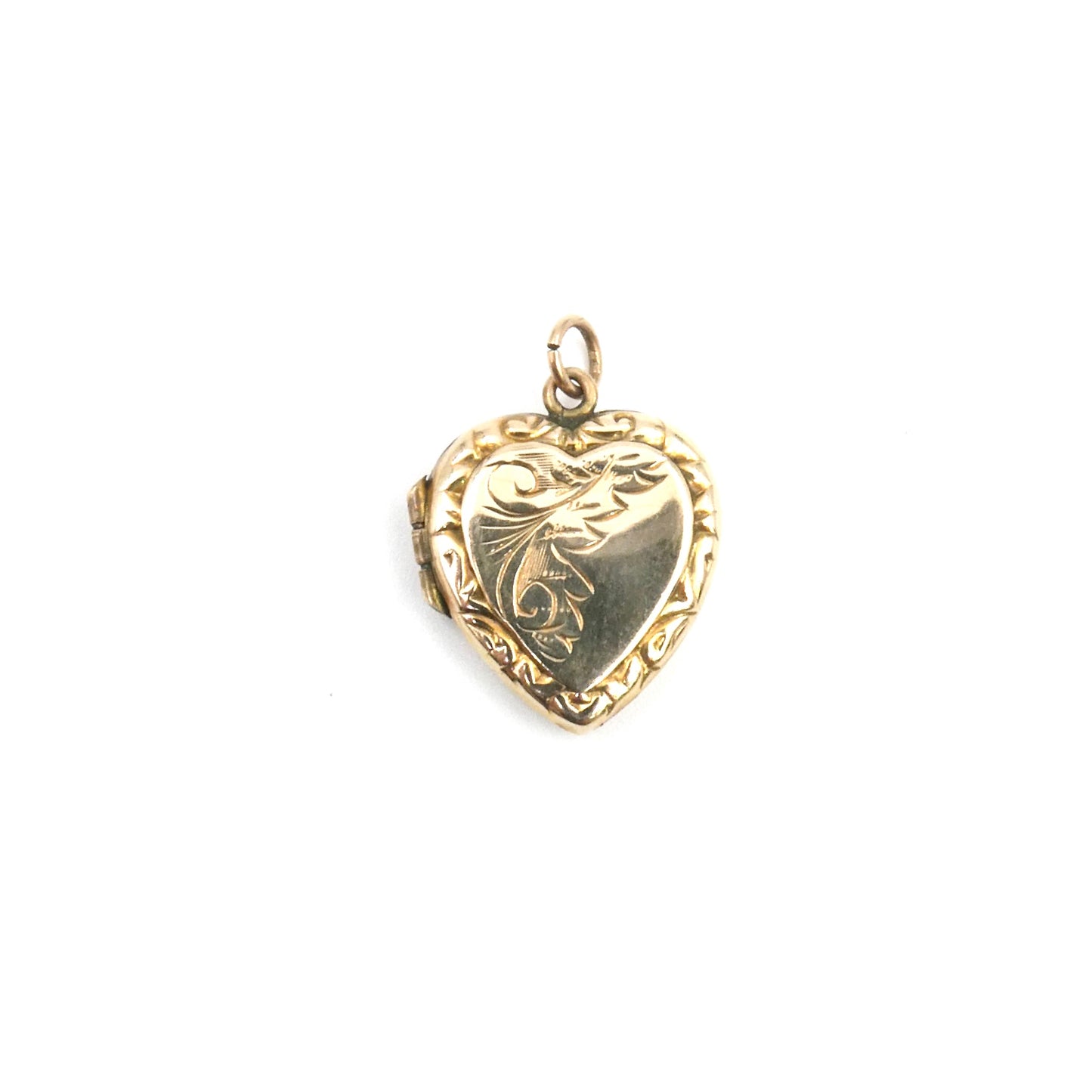 Ornate vintage locket, an engraved locket in a heart shape, back and front heart locket.