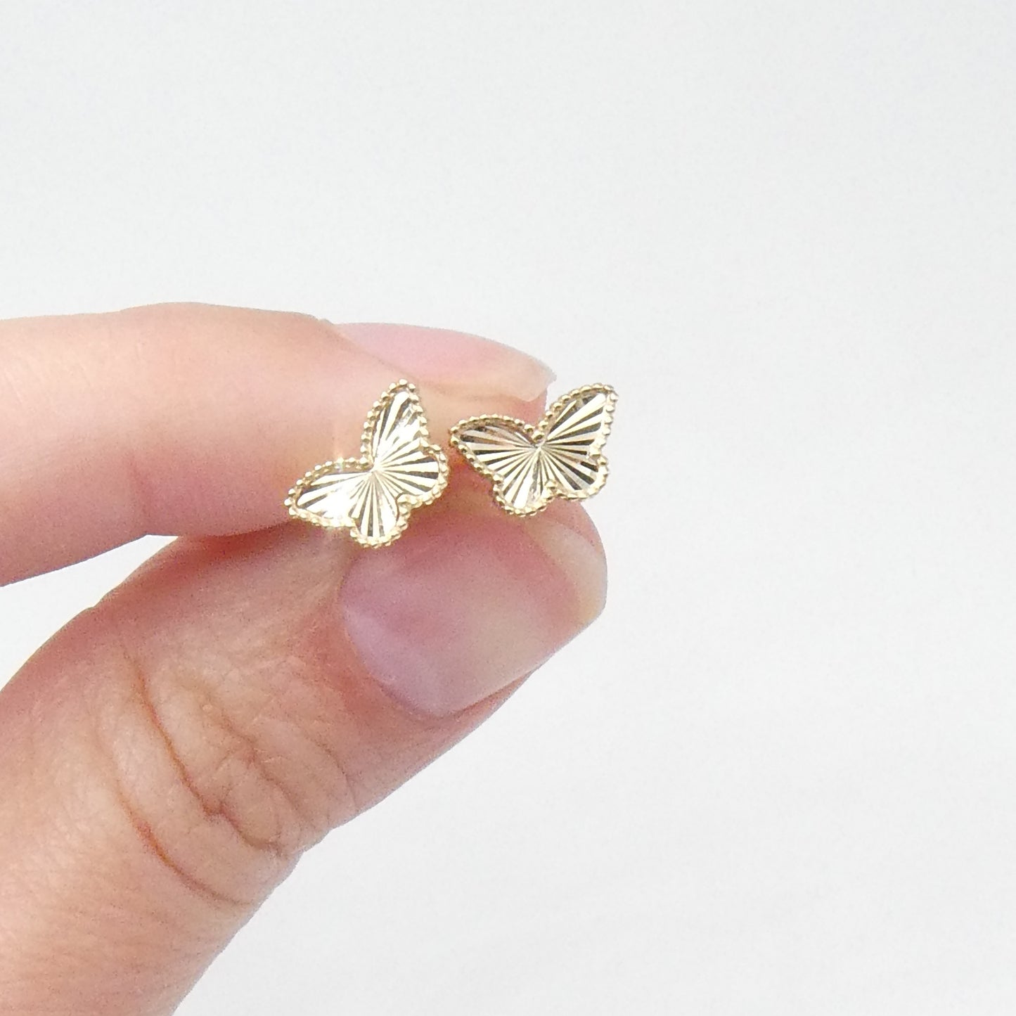 A 9kt gold faceted butterfly studs