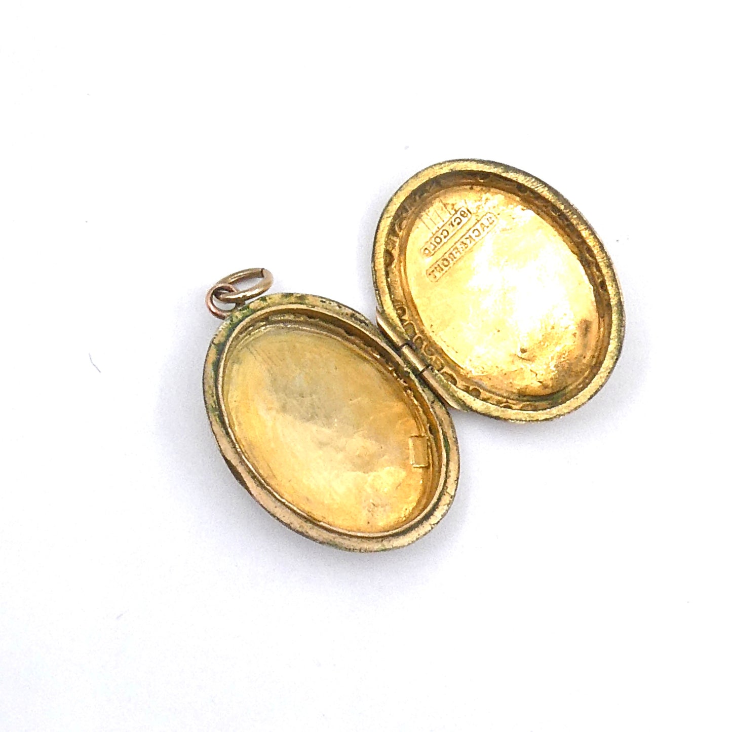 Engraved oval locket, antique gold back and front locket on a 9kt gold chain.