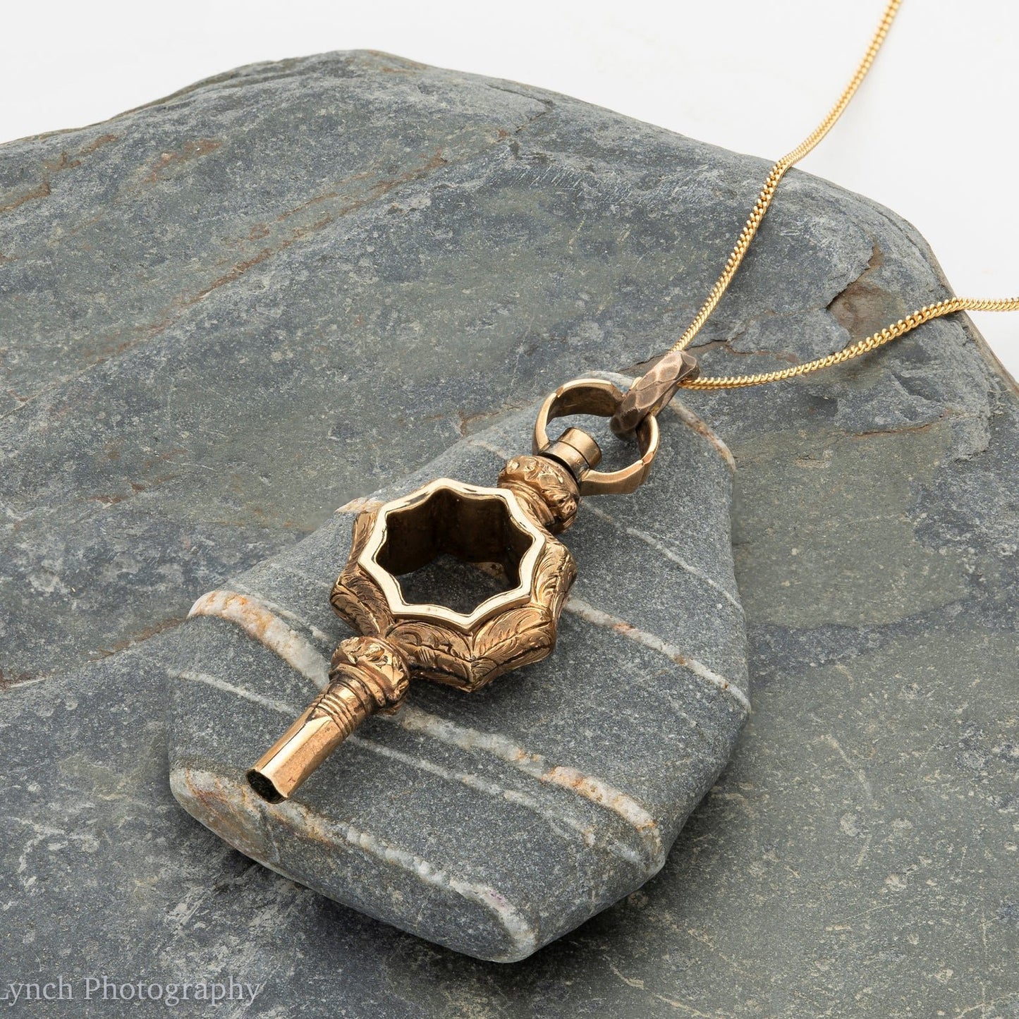 Antique watch key, a perfect antique pendant to hang on a chain, an old watch key.
