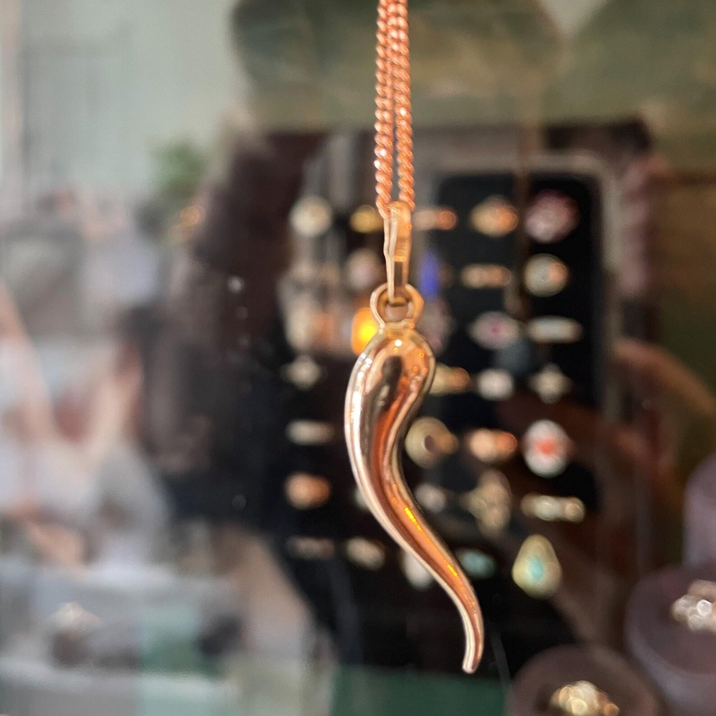 Vintage rose gold cornicello pendant, a long twisted horn that was worn as a symbol of good luck to ward off the evil eye