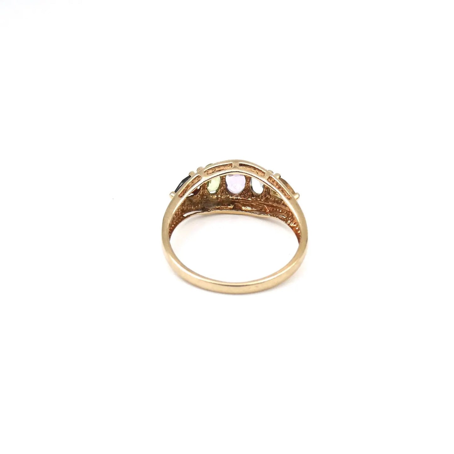 An unusual gold ring set with gemstones framed by the 9kt gold setting,