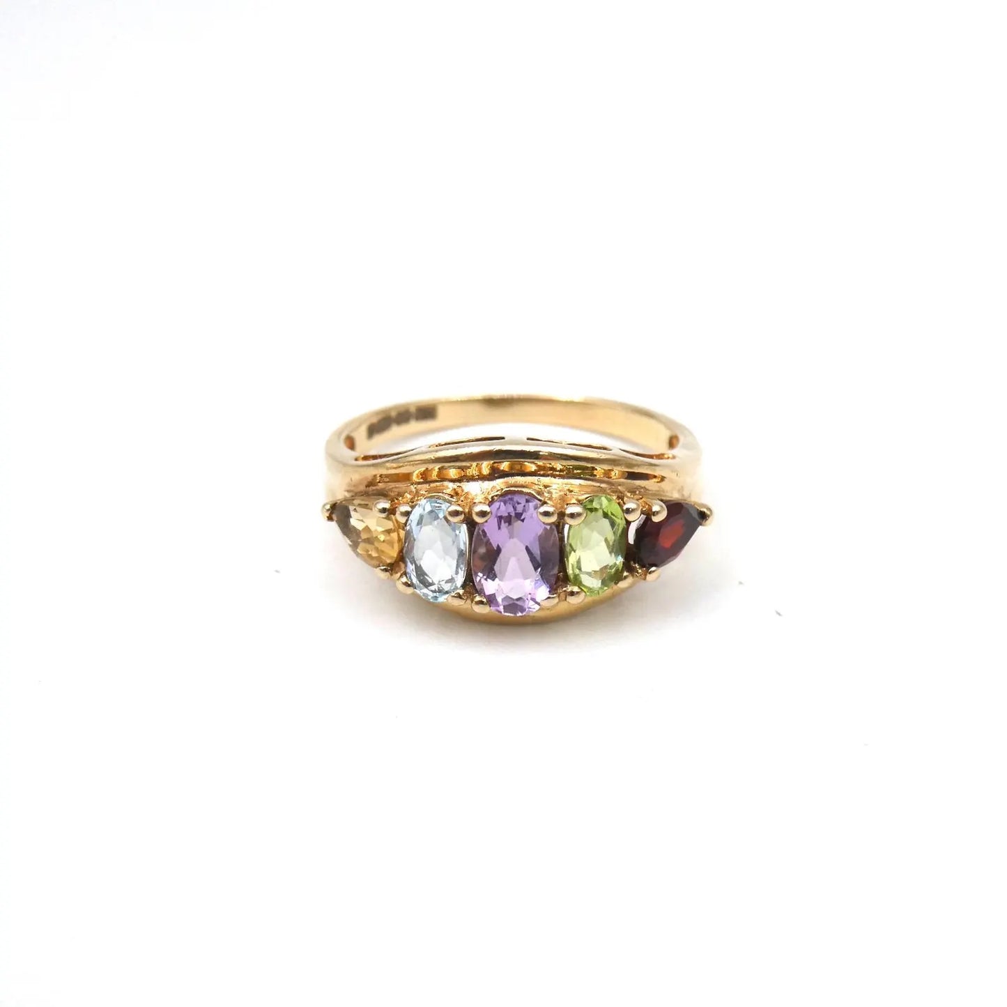 An unusual gold ring set with gemstones framed by the 9kt gold setting,