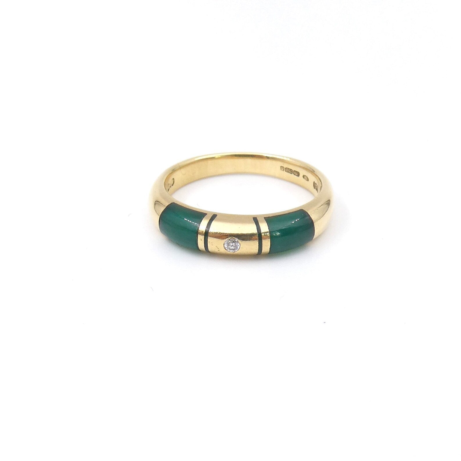 An 18kt gold band with an inlay of green aventurine set with a diamond. - Collected