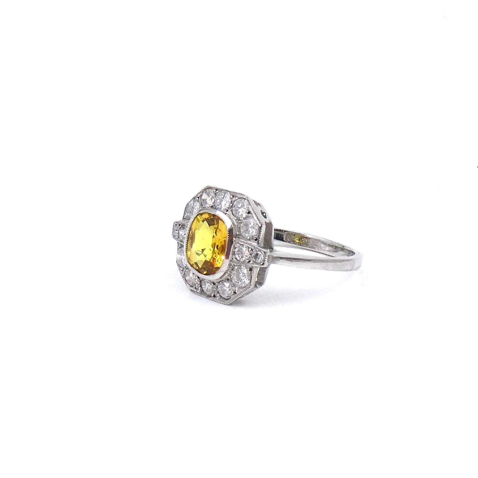 An art deco style yellow sapphire and diamond ring. - Collected