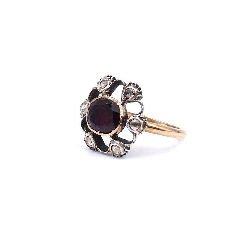 Antique garnet and old cut diamond ring with an open design. - Collected