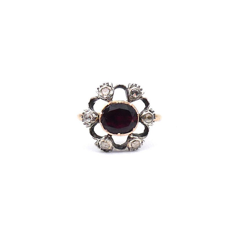 Antique garnet and old cut diamond ring with an open design. - Collected