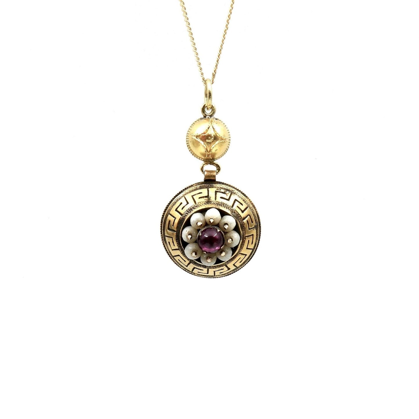 Antique pendant with an Etruscan pattern and a garnet gemstone surrounded by glass beads. - Collected