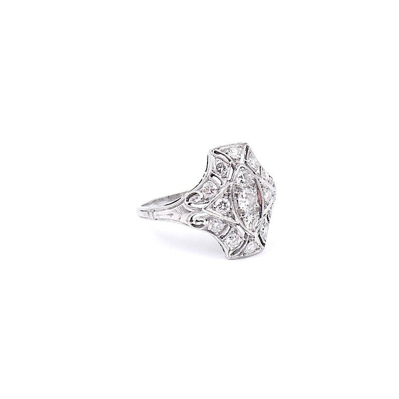 Art Deco diamond ring, with curved lines and a pierced setting. - Collected