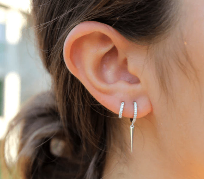 Silver pave huggies with a spike. - Collected