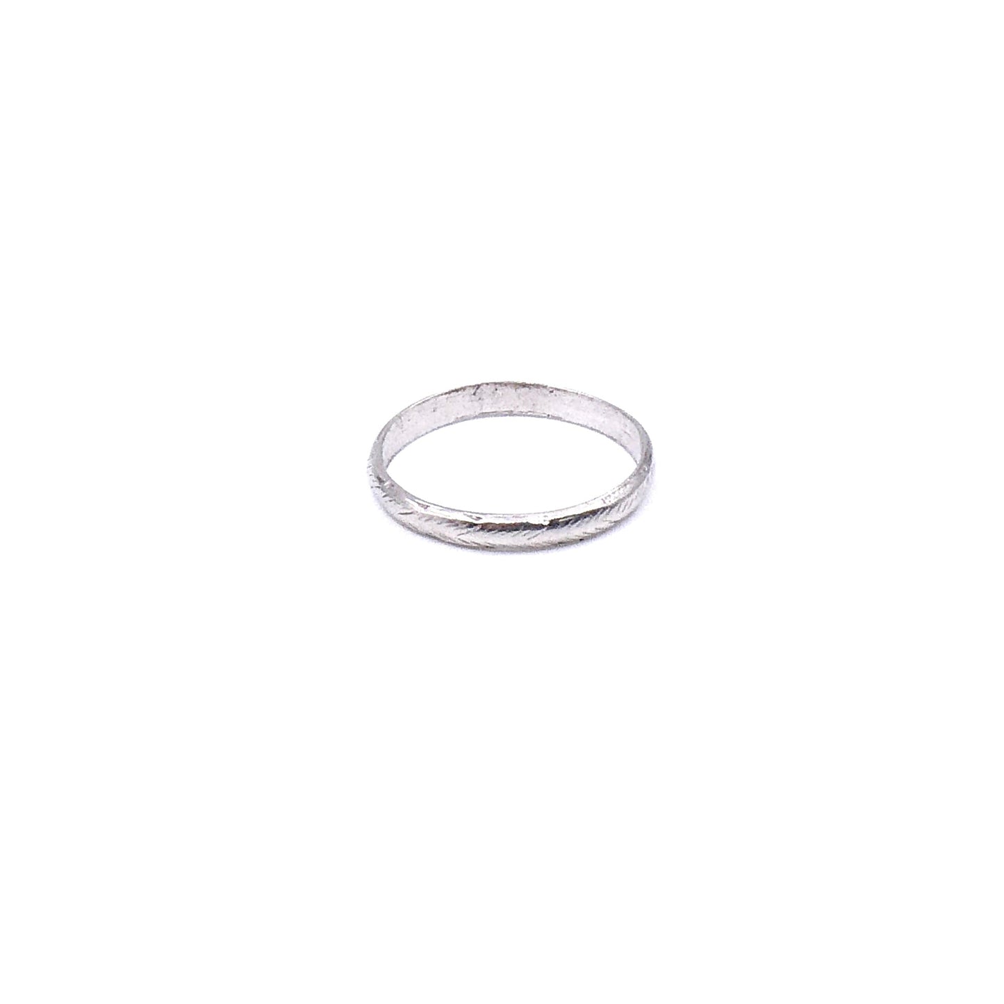 Vintage platinum band with a worn feathered pattern around the band. - Collected