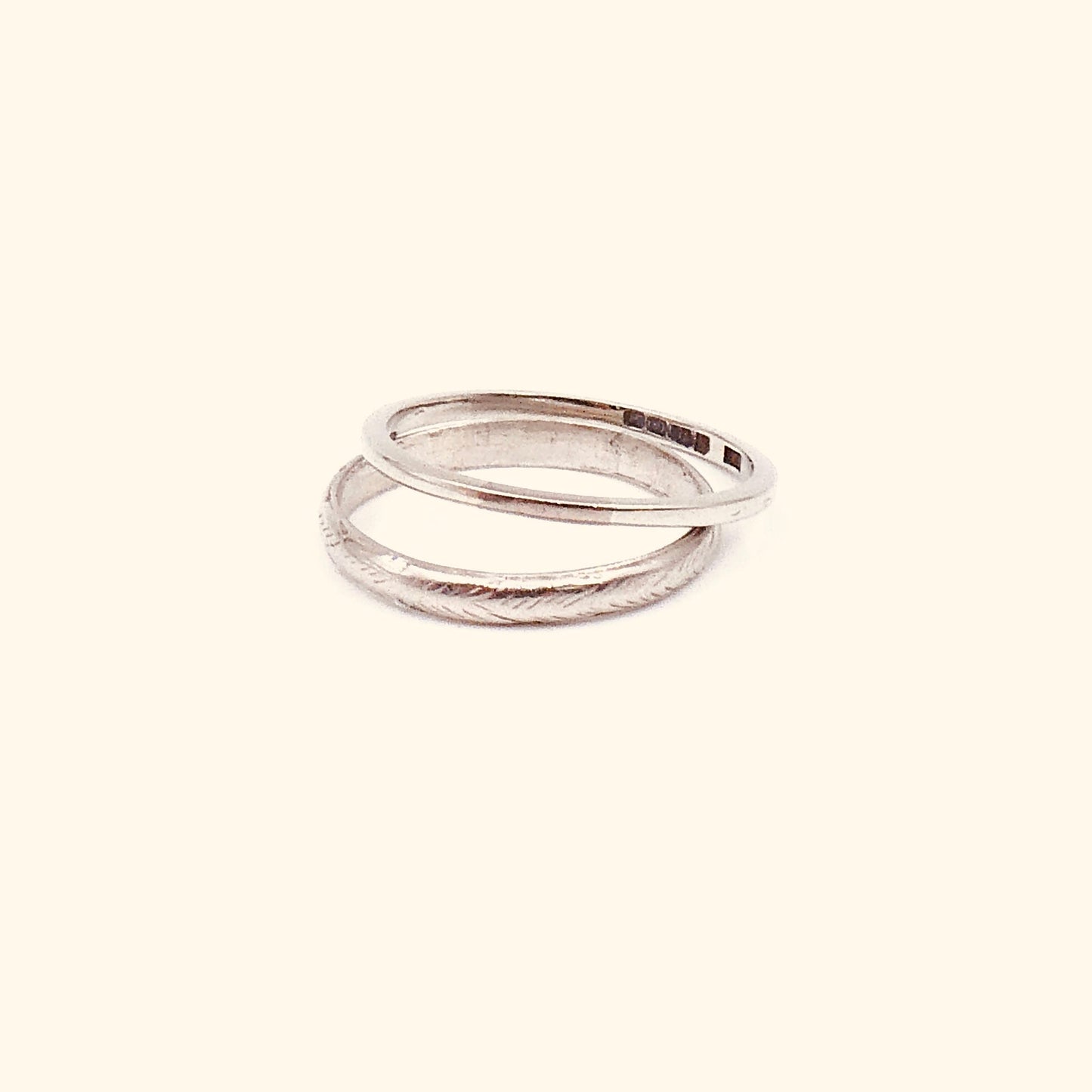Vintage platinum band with a worn feathered pattern around the band. - Collected