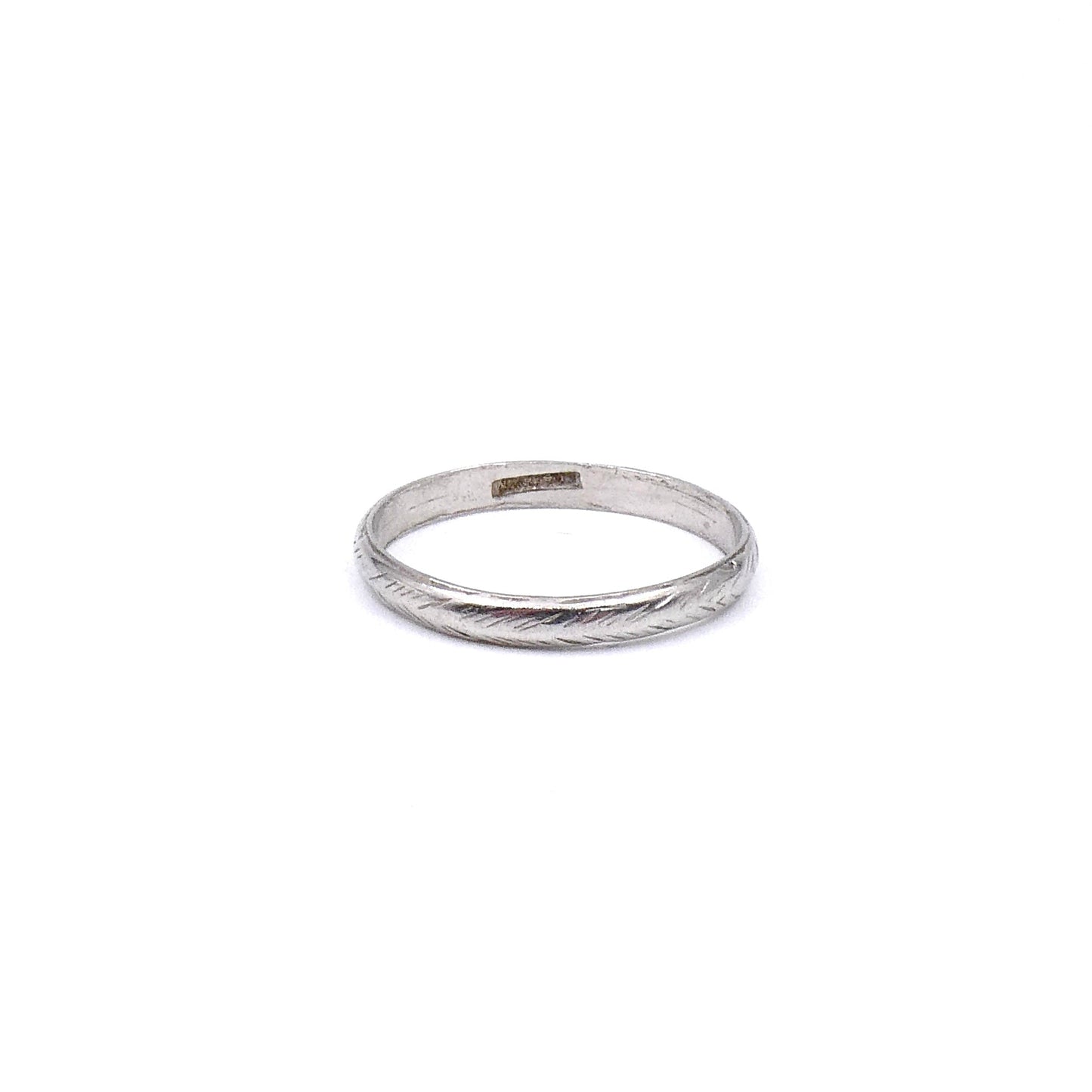 Vintage platinum band with a worn feathered pattern around the band. - Collected