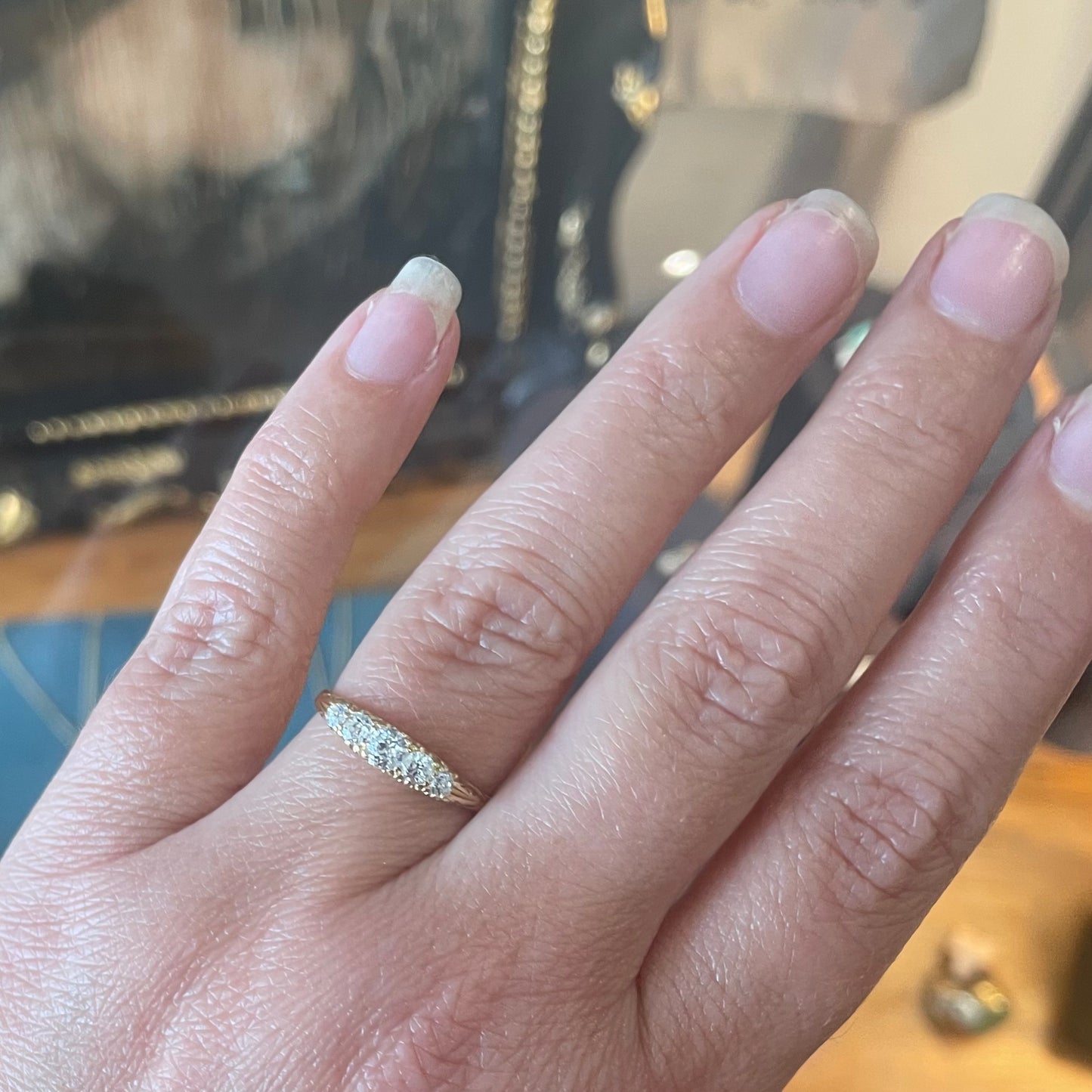 Antique Diamond ring set with five old European cut Diamonds.