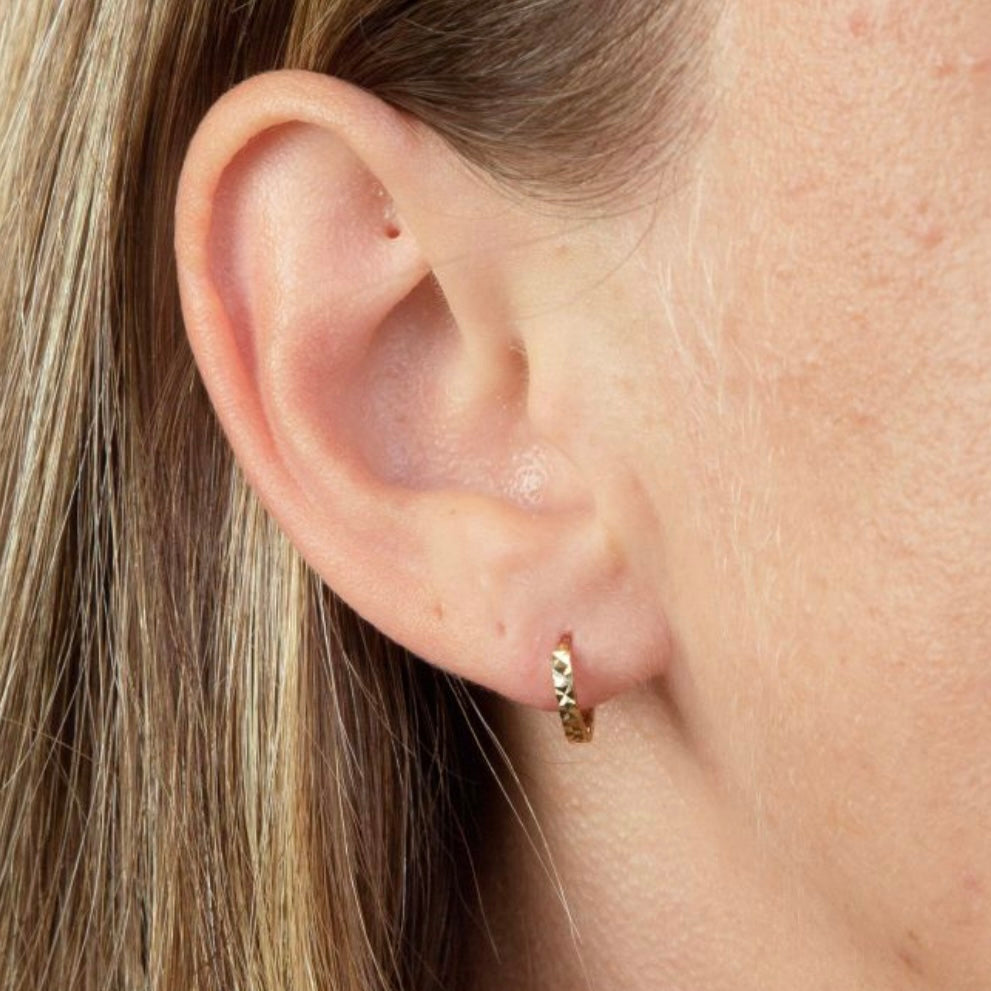 Faceted 9kt gold mini Hoops, for a first or second piercing.