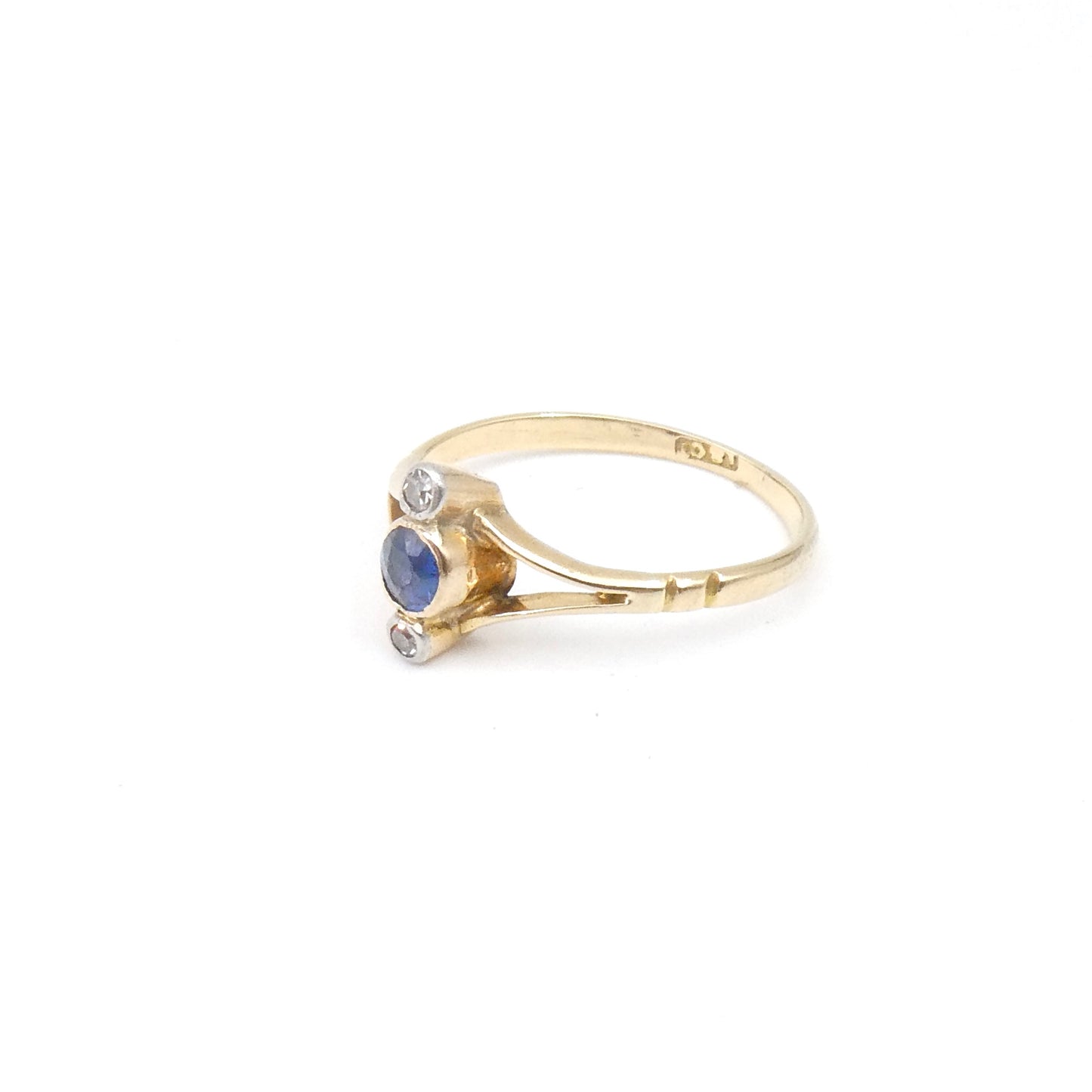 Vintage sapphire diamond ring, vertically set in an Edwardian open style.