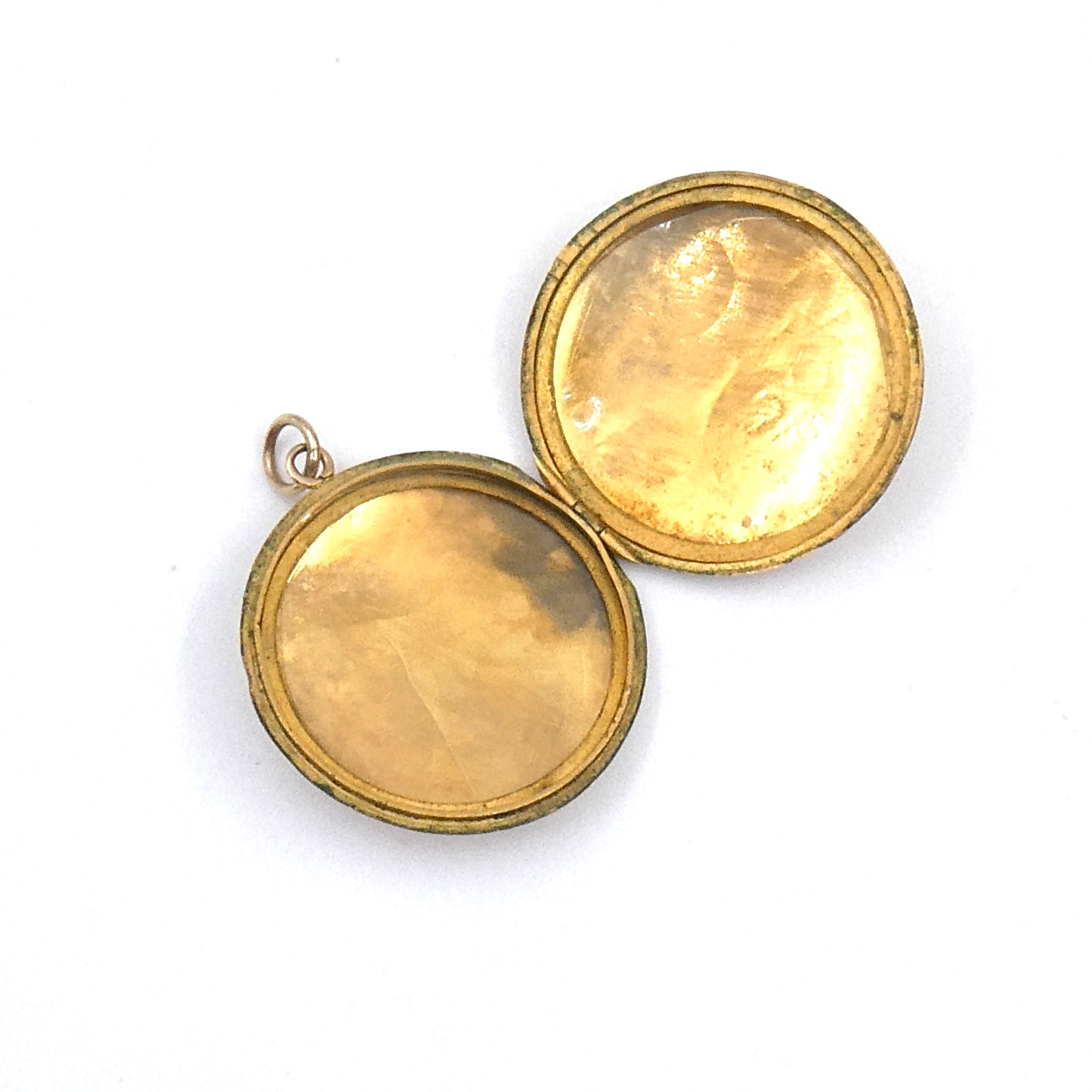 Victorian round locket with an elegant scroll motif, on a 9kt gold chain.