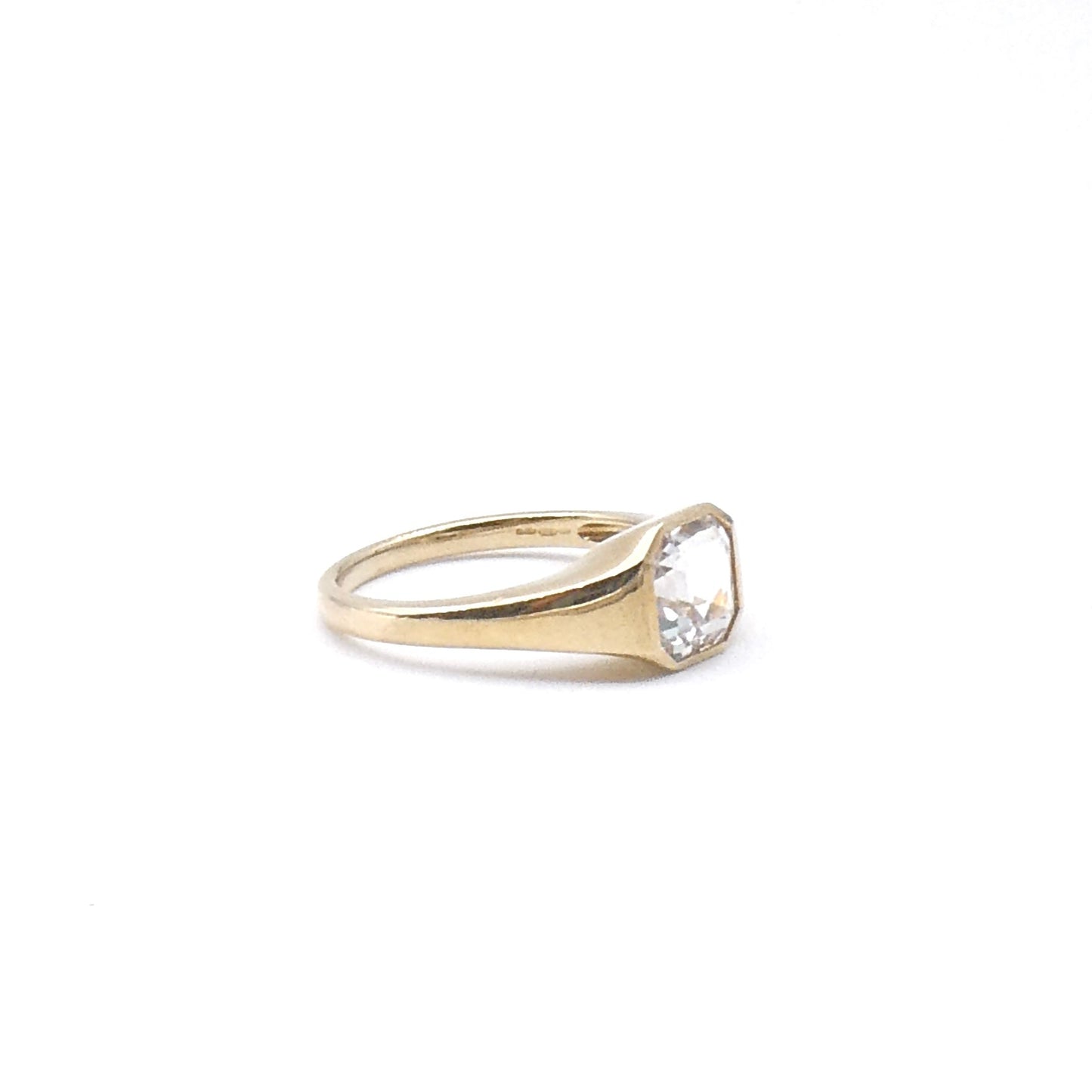 An Assher cut white topaz ring set in 9kt gold, a new clean contemporary ring.