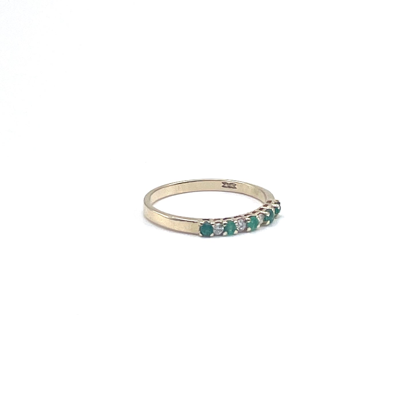 Fine alternating emerald and diamond stacking ring, preowned.