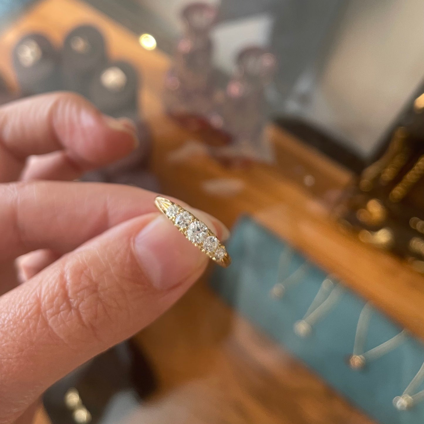 Antique Diamond ring set with five old European cut Diamonds.