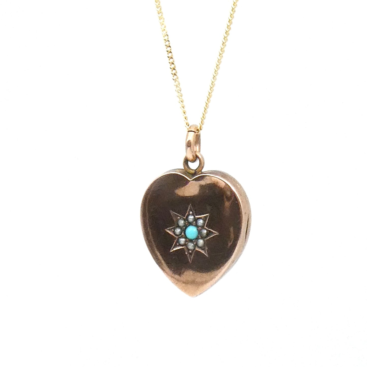 Antique Heart Locket and a turquoise and split pearl star set motif, on a 9kt gold chain.