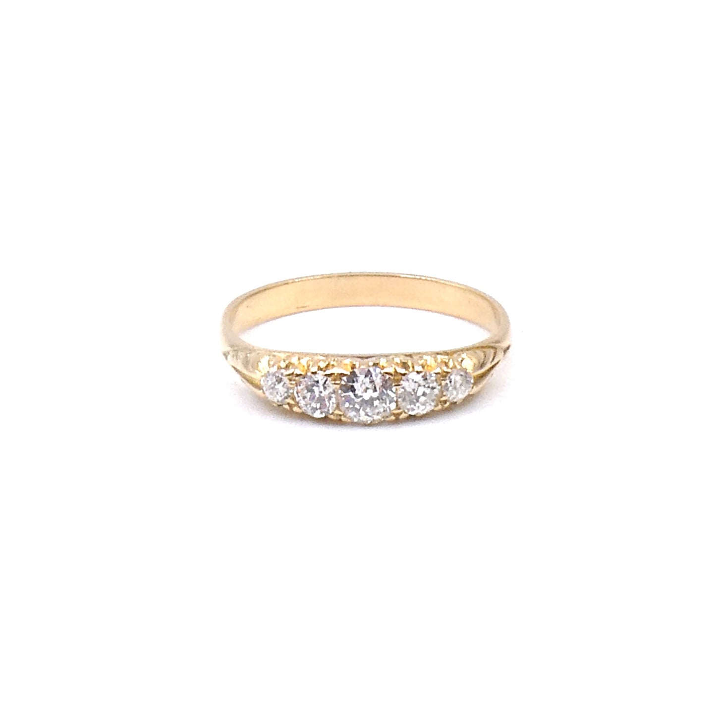 Antique Diamond ring set with five old European cut Diamonds.
