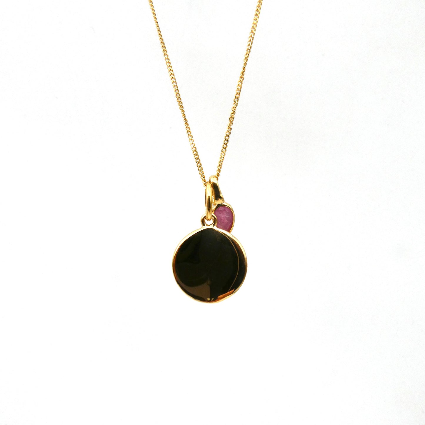 Gold Disc with a pink quartz charm, for a July birthday.