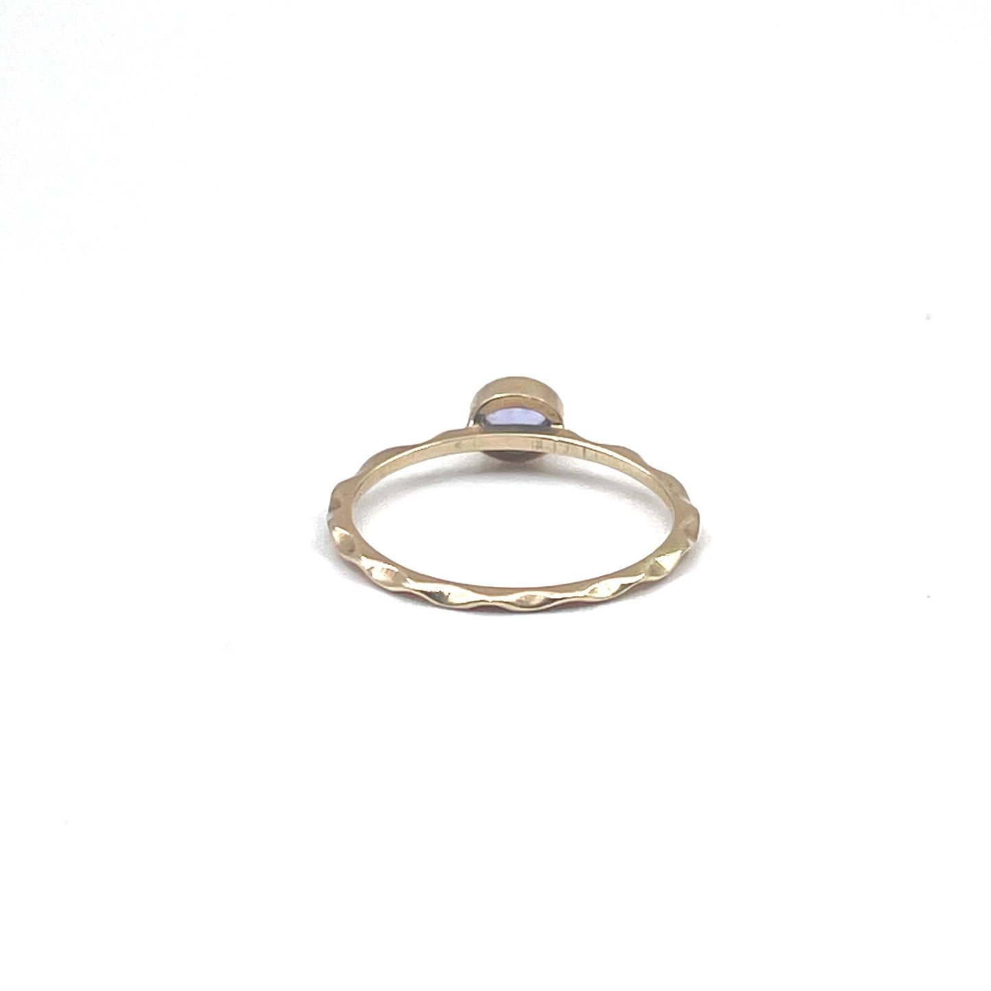 Tanzanite stacking ring on a 9kt wave band, preowned.