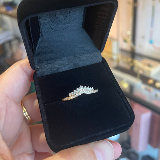 A Diamond ring with a crown of graduating sized diamonds.