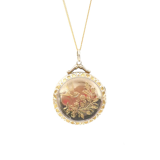 Antique locket, gold back and front locket with an engraving of a swallow and leaf motif  on a 9kt gold curb chain.