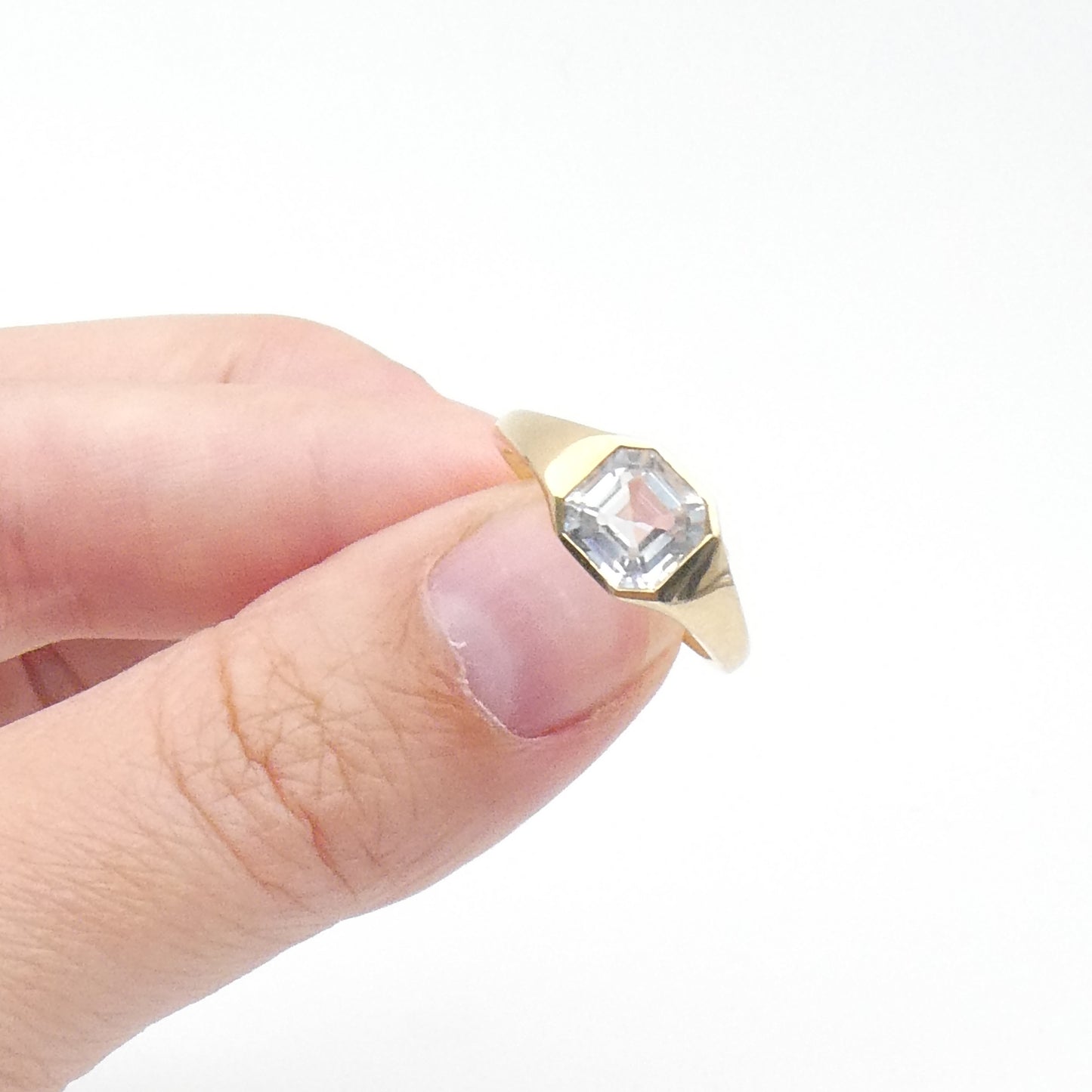 An Assher cut white topaz ring set in 9kt gold, a new clean contemporary ring.