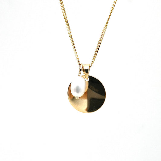 Gold Disc Pendant with a 9kt gold and pearl charm.