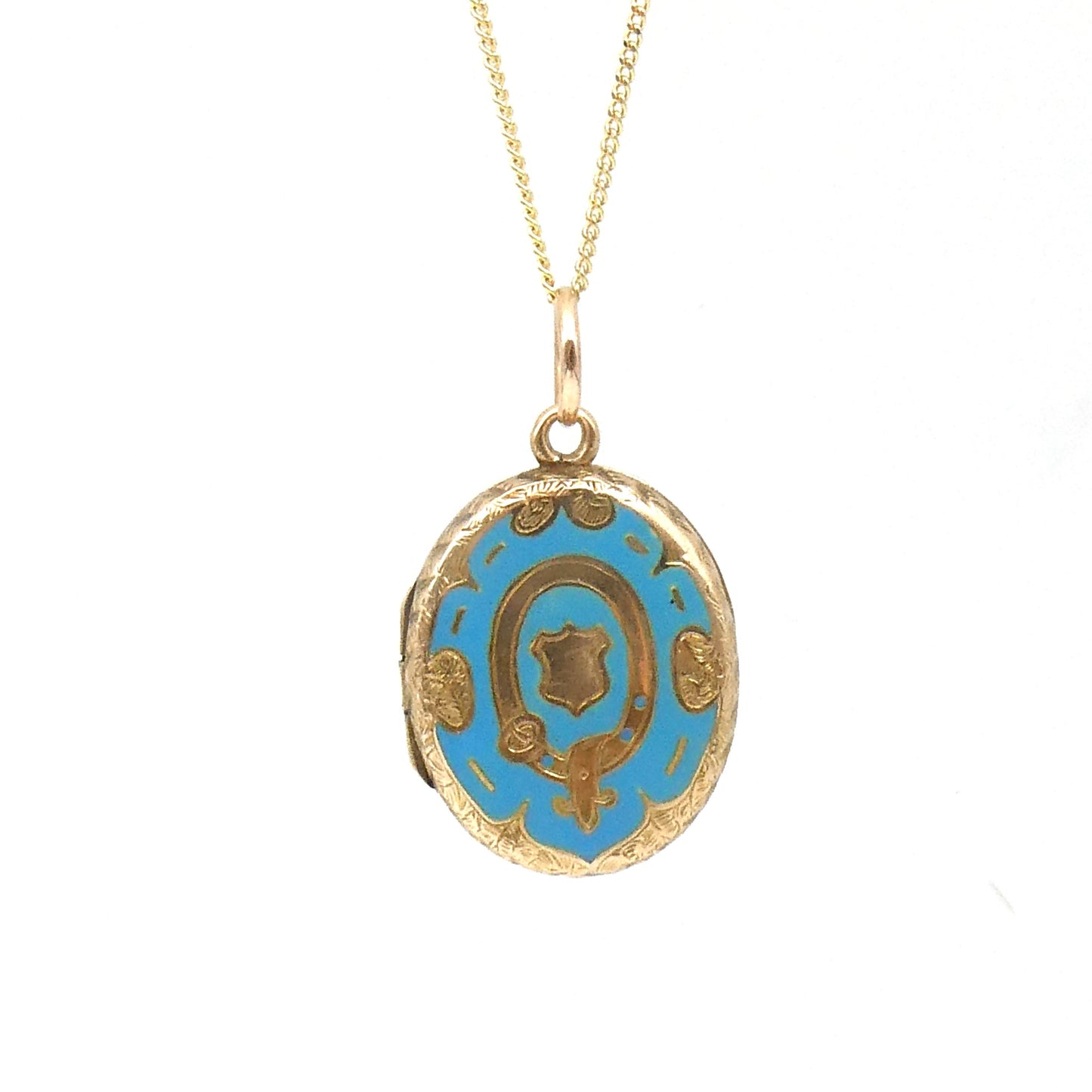 Antique Enamel Locket with blue enamel, within a victorian pattern of a belt & shield
